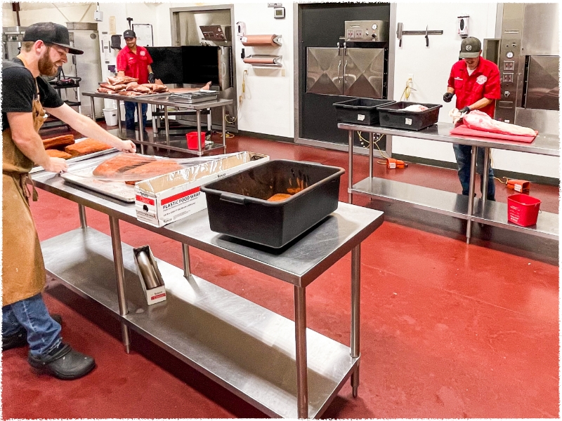 team preparing meat